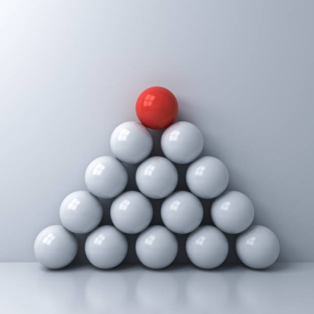 istock Stand out from the crowd and Leadership creative idea concepts One red sphere standing on top of the other white spheres on white wall color background with reflections and shadows 3D rendering 1135131699