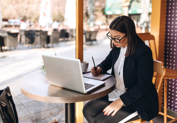 istock Woman working comfortably at a cafe 1135132036