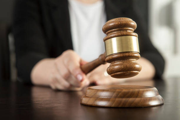 istock Gavel in woman hand 1135132380