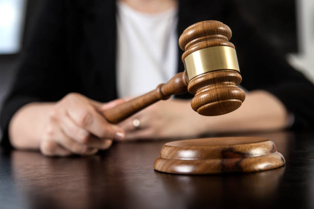 istock Gavel in woman hand 1135133194