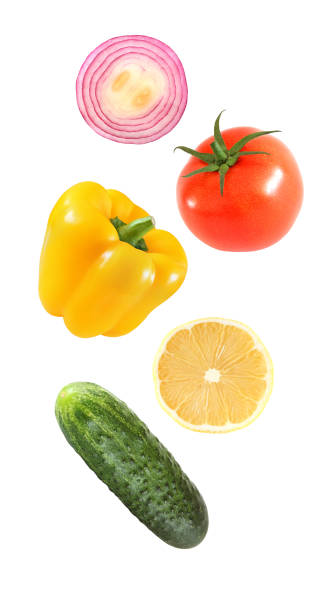 istock Falling flying vegetables bell pepper, onion, lemon, cucumber, tomato isolated on white background with clipping path. 1135133360