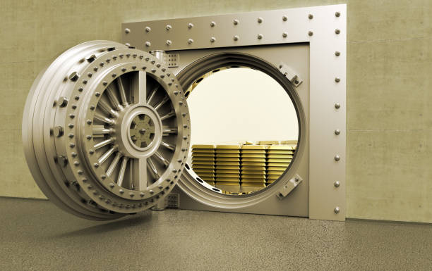 istock bank Vault with gold bars inside 1135134813