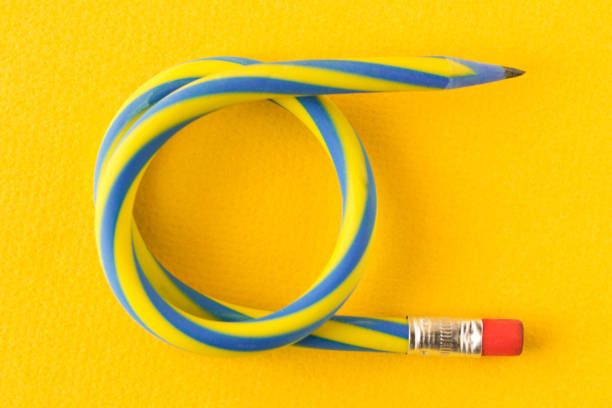 istock Flexible pencil . Isolated on yellow background. Bending pencil. 1135134872