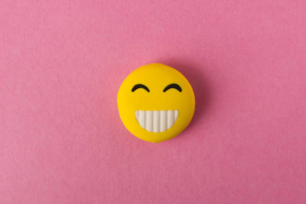 istock Funny smiley face on pink background. Positive mood. Empty text space. 1135135130