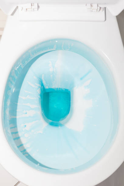 istock White toilet bowl with blue detergent 1135135303