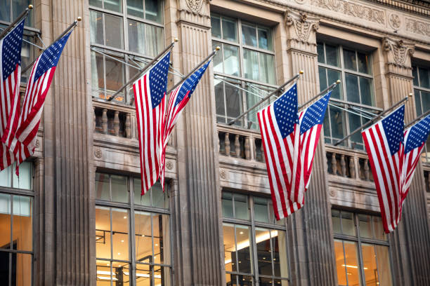 istock American Flags Against Office Building 1135136235