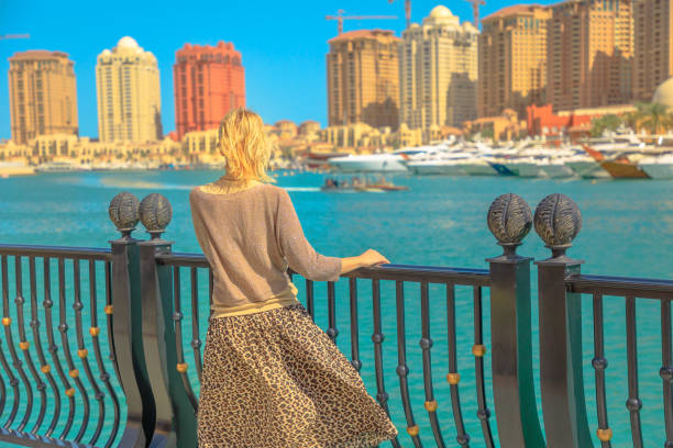 istock Woman at Porto Arabia 1135136552
