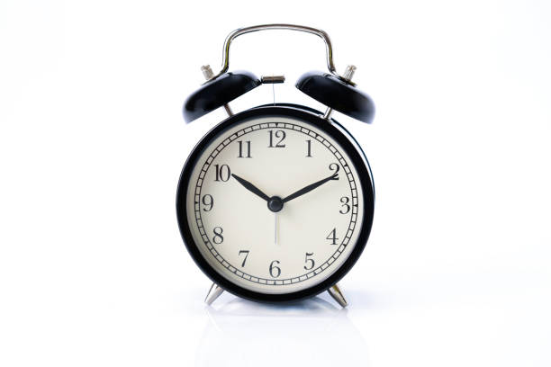 istock Black retro Alarm clock isolated on white background 1135137512