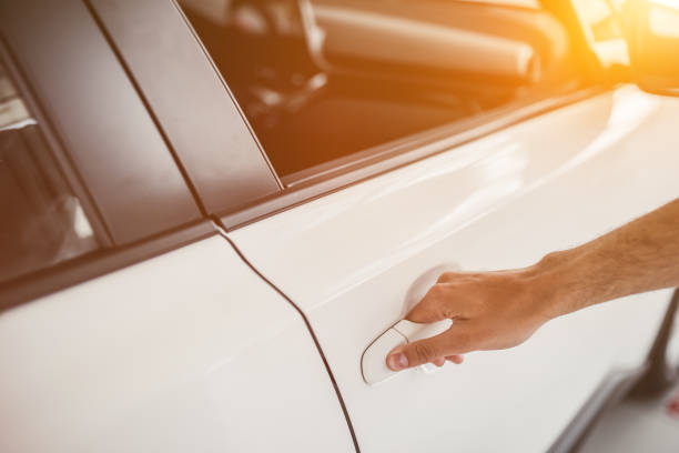 istock Man in car dealership 1135138350