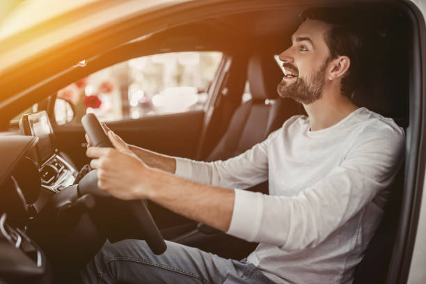 istock Man in car dealership 1135138363