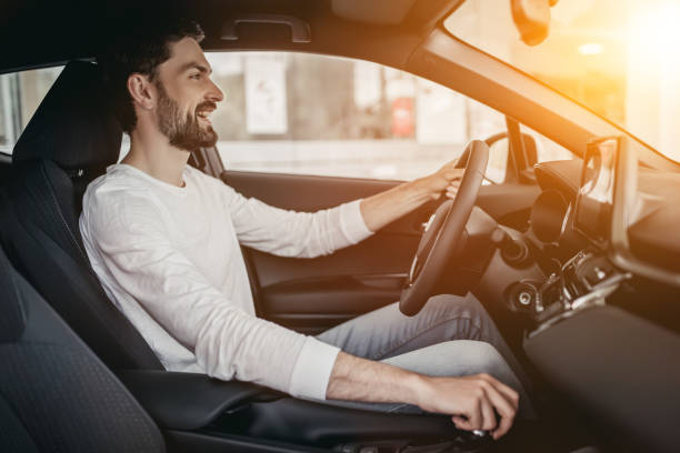 istock Man in car dealership 1135138370