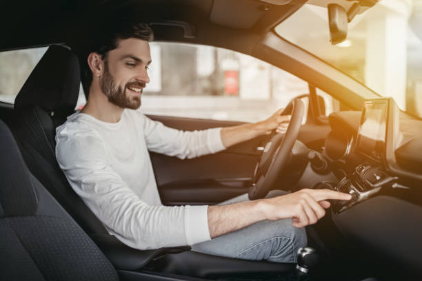 istock Man in car dealership 1135138384