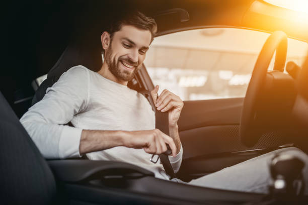 istock Man in car dealership 1135138400