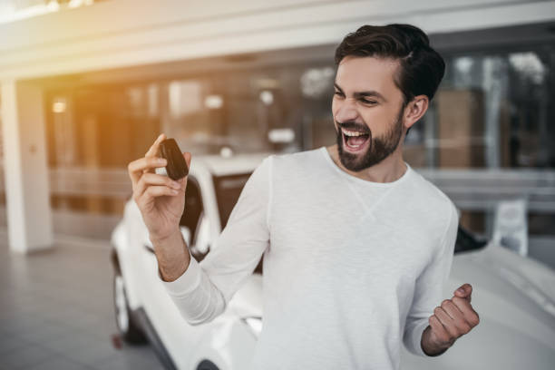 istock Man in car dealership 1135138886