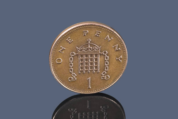 istock British One Penny on gray background closeup 1135139354