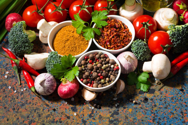 istock assortment of spices and fresh organic vegetables on a dark background, horizontal 1135139549