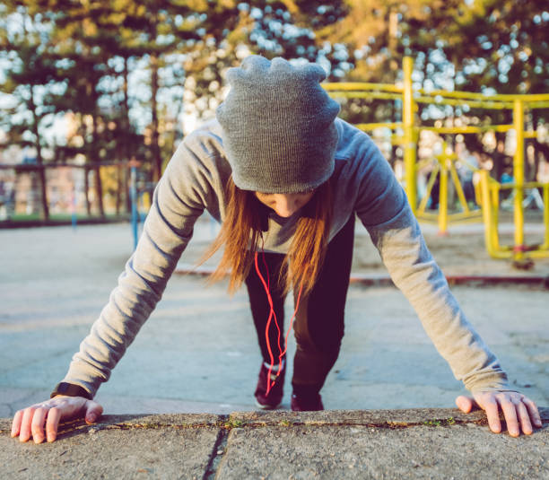 istock Woman exercising in a public park 1135142714