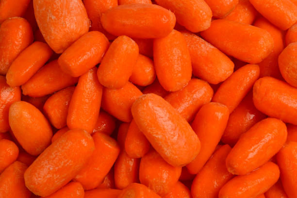istock Little fresh carrots as a background. Snack. 1135142745
