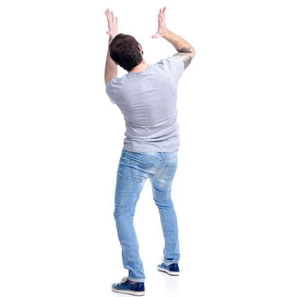 istock Man in jeans standing looks up, shock wow 1135144629