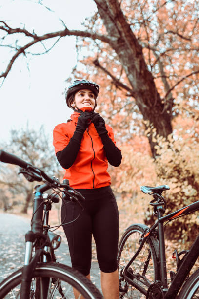 istock Female Cyclist Taking A Break After Riding Session 1135145469