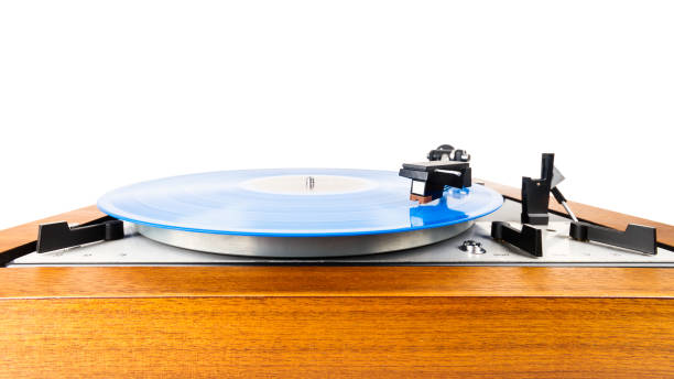 istock Vintage turntable with a blue vinyl isolated on white 1135148531