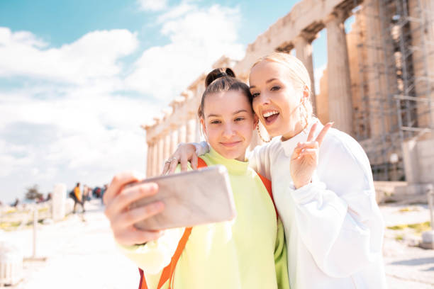 istock Two young female tourists in Acropolis - Athens 1135149561