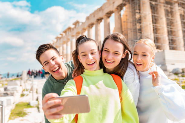 Group of young tourists in Acropolis - Athens