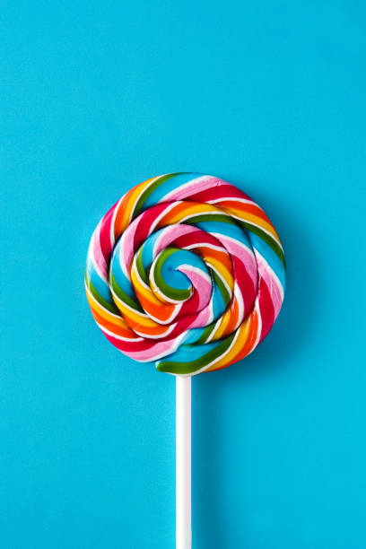 Colorful lollipop Colorful lollipop on blue background spectrum photos stock pictures, royalty-free photos & images