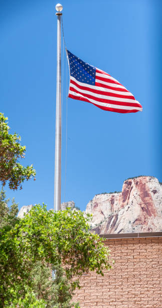 istock American Flag waving with National Park on background 1135152573