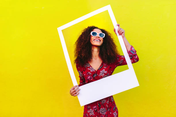 istock Beautiful woman with blank picture frame 1135152691
