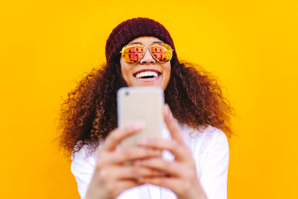 istock Stylish african woman making selfie 1135152924