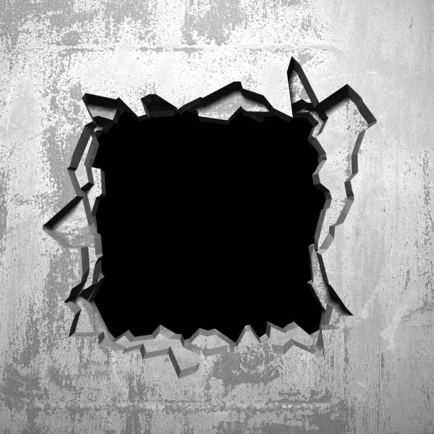 istock Dark cracked broken hole in concrete wall 1135153022