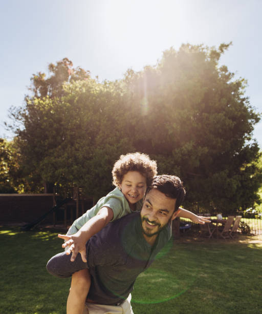 istock Father and son playing in the park 1135153721