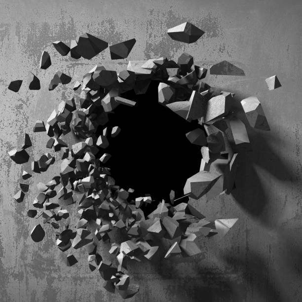 istock Dark cracked broken hole in concrete wall 1135154324