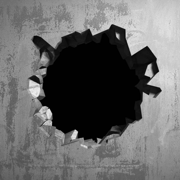 istock Dark cracked broken hole in concrete wall 1135154419
