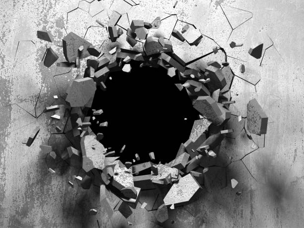 istock Dark cracked broken hole in concrete wall 1135154454
