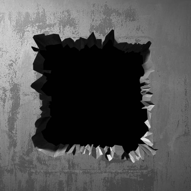 istock Dark cracked broken hole in concrete wall 1135156524