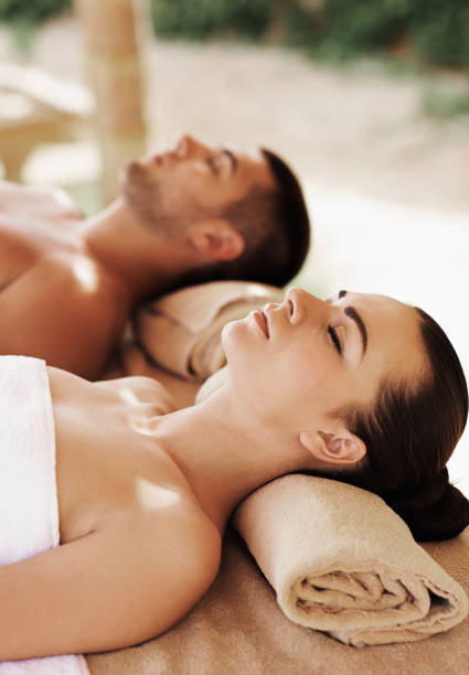 istock Couple having outdoor hot stone therapy 1135156714