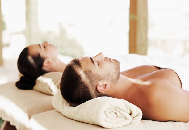 istock Couple having outdoor hot stone therapy 1135156793