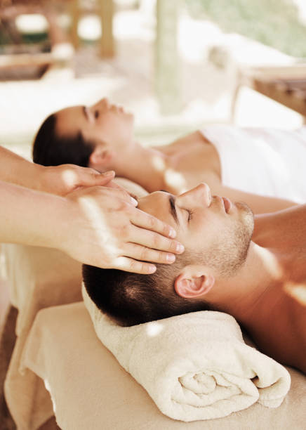 istock Couple having outdoor hot stone therapy 1135156834
