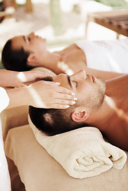 istock Couple having outdoor hot stone therapy 1135156856