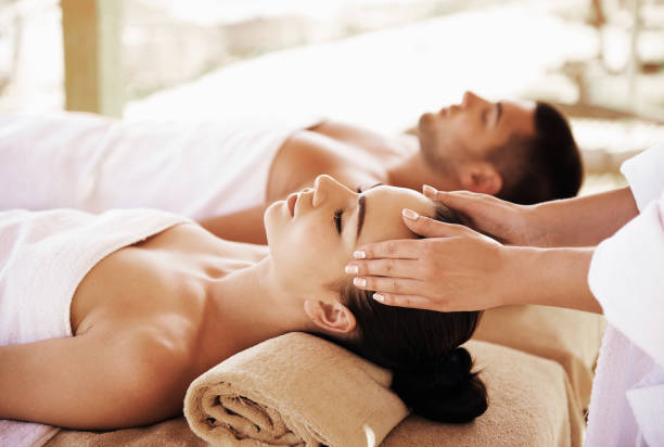 istock Couple having outdoor hot stone therapy 1135156893