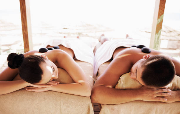 istock Couple having outdoor hot stone therapy 1135156915