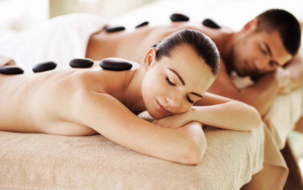 istock Couple having outdoor hot stone therapy 1135157754
