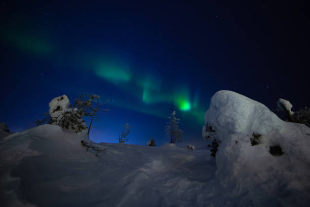 istock Northern lights with heavy snow 1135157964