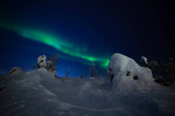 istock Northern lights with heavy snow 1135158029