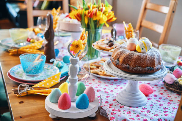 istock Decorated Table for Easter with Easter Eggs, Cookies, Cake and Flowers 1135158081