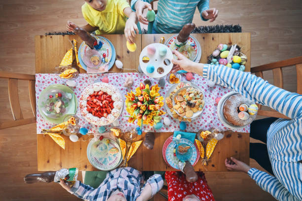 istock Cute Little Kids Having Fun on a Decorated Easter Table 1135158100
