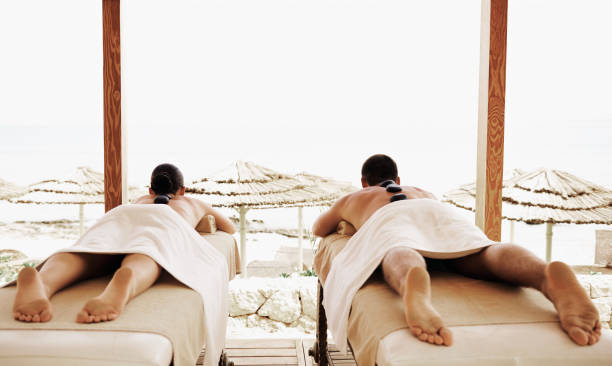 istock Couple having outdoor hot stone therapy 1135158413