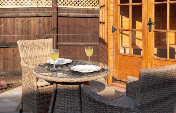 istock Table set for outdoor dining in sunshine on a patio 1135163249